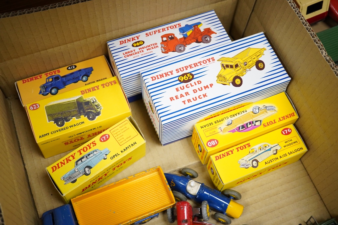 Twenty Dinky Toys, seven in reproduction boxes, including; Opel Kapitan, Austin A105 saloon, Packard Clipper Sedan, Euclid rear dump truck, Daimler ambulance, NCB electric van, etc.